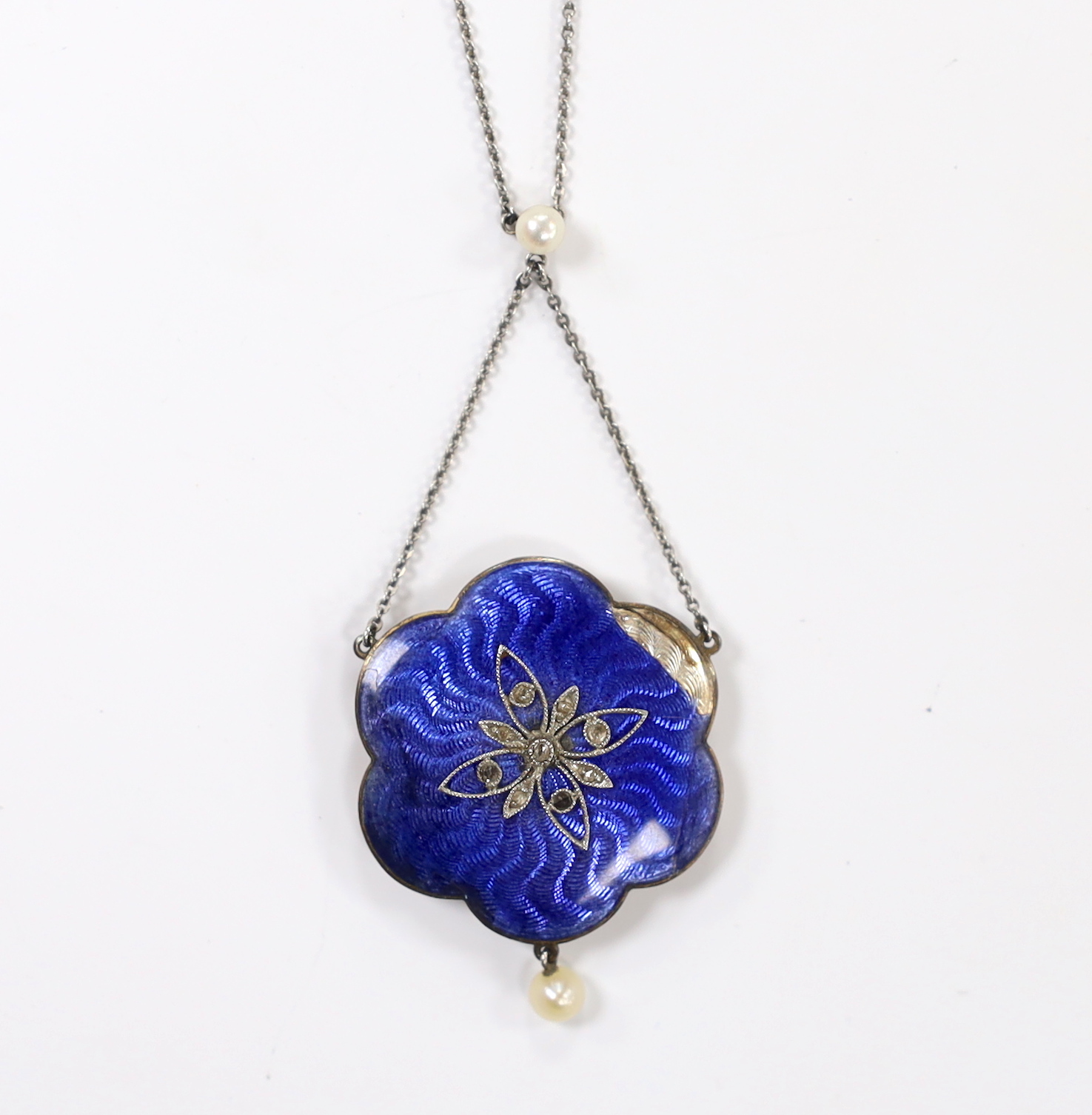 An Edwardian white metal, enamel, seed pearl and rose cut diamond chip set drop pendant necklace, overall 47cm (a.f.)